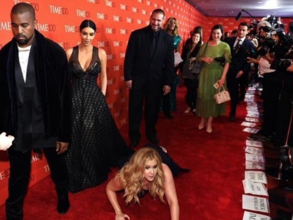 Amy Schumer Threw Herself At The Feet Of Kim And Kanye On A Red Carpet And Pretended To Worship Them