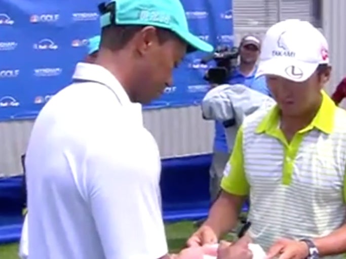 Tiger Wore A Turquoise Hat, Shot A 64 Then Signed An Autograph For Hideki Matsuyama's Caddie
