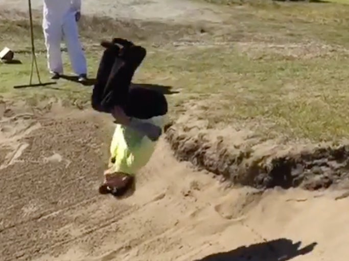 Golfer Lady Gets A Mouthful Of Sand When She Tries To Back Flip Into A Bunker