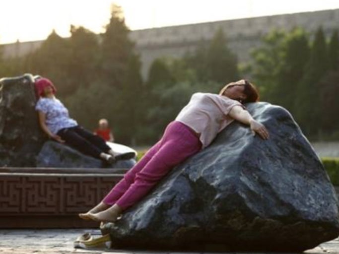 Chinese Women Are Laying On Hot Rocks In The Sun To Cure Their Illnesses