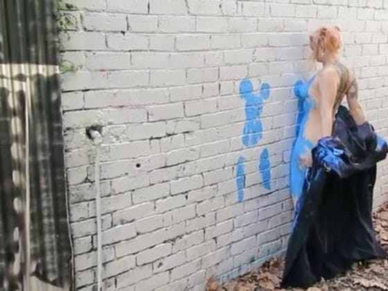 Street Artists are Going Around Making Imprints of Their Naked Bodies