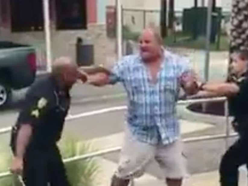 Portly Gentleman Calmly Removes Multiple Police Tasers While Being Beaten For Not Paying A Bar Tab