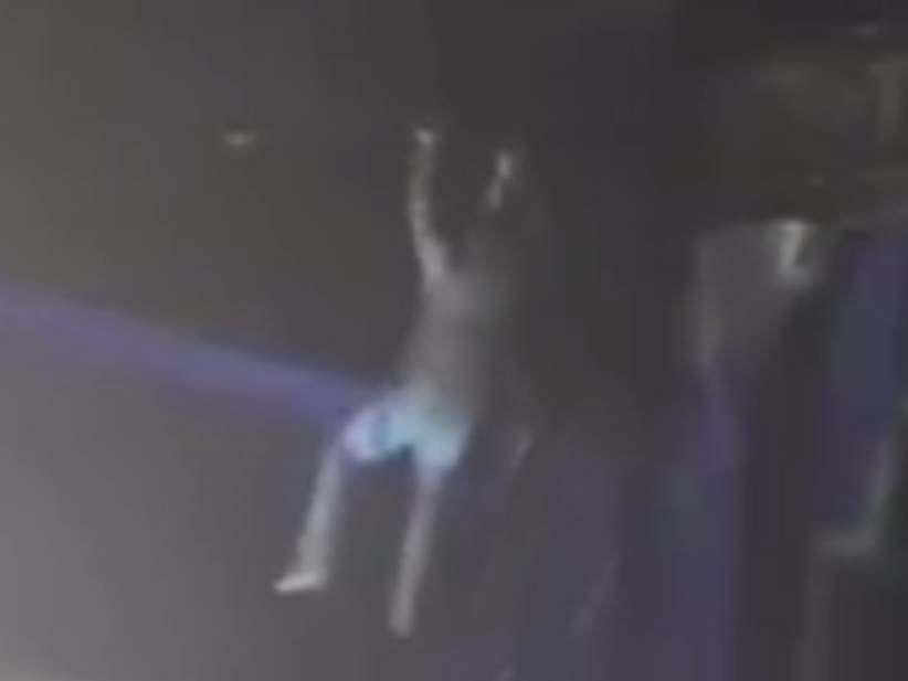 Get A Load Of This Suicidal Gym Rat Doing Pullups In The Rafters 50 Feet Above The Stage At A Kodak Concert