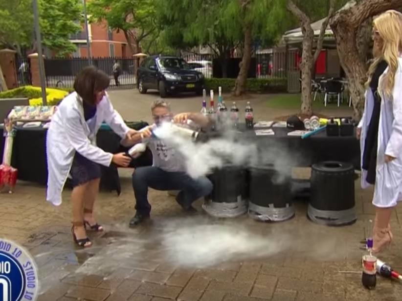 Liquid Nitrogen Filled Coke Bottle Comes SO CLOSE To Decapitating TV Host Live On-Air