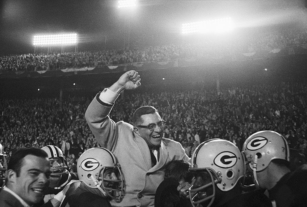 Vince Lombardi Being Carried by Football Players